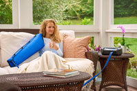 Woman using Bio Compression SC-4004-DL sequential circulator arm compression sleeve for lymphedema and swelling relief